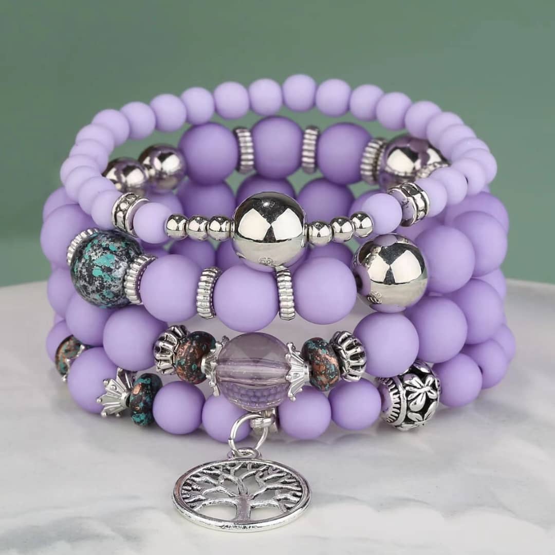 4 layered purple beaded bracelet with charms