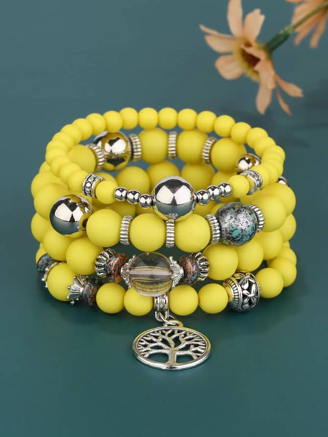 4 layered yellow beaded bracelet with charms