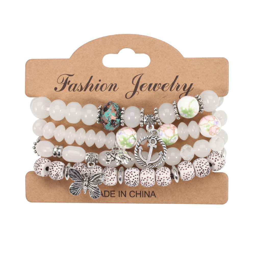 White Beaded Bracelet With Charms